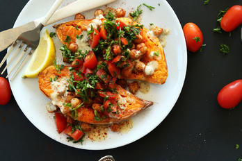 A bowl of Recipes of Inspiration with a knife and fork beside it